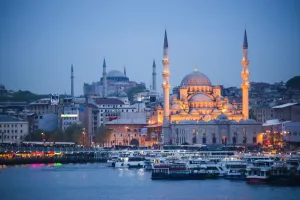 Traditionally Turkish Prints: New Mosque (Yeni Cami) at night with Hagia Sophia (Aya Sofya) behind seen across the Golden Horn