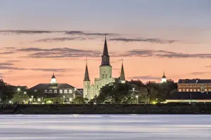 French Quarter Prints: New Orleans skyline, view of Saint Louis Cathedral from across the Mississippi River at sunset