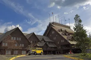 Buses Prints: New restored yellow Yellowstone coach outside the historic Old Faithful Inn