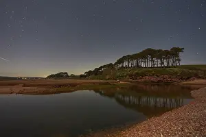 Stillness Prints: Night sky above River Otter estuary showing trees and water in Budleigh Salterton on Devon coast