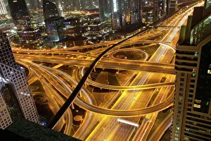 Bustling Prints: Night traffic on a busy intersection on Sheikh Zayed highway, Dubai, United Arab Emirates