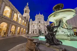 Marche Prints: Night view of the Basilica of the Holy House and fountain decorated with statues