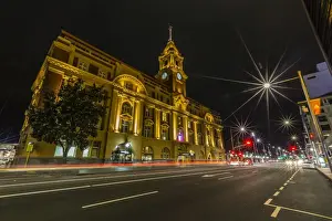 Auckland Prints: Night view of the Britomart Transport Centre in the city of Auckland from Auckland Harbour
