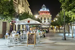 Rotunda Prints: Night view of cafes along Calle Lanceria and El Gallo Azul rotunda building