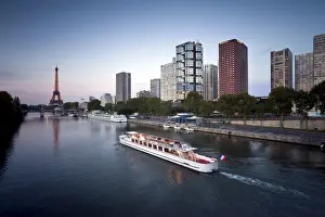Vessel Prints: Night view of River Seine with high-rise buildings on the Left Bank and Eiffel Tower in the distance