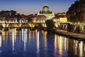 River Tiber Prints: Night view of San Angelo Bridge on River Tiber with background of illuminated St