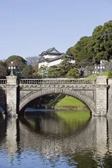 Images Dated 18th December 2009: Niju Bashi bridge reflecting in moat, Imperial Palace, Tokyo, Japan, Asia