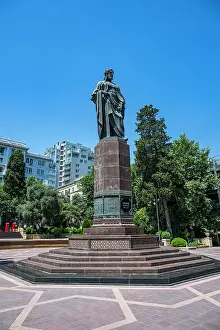 Recreational Prints: Nizami Ganjavi Monument stands in a park setting with clear skies in Baku Azerbaijan