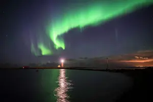 Glowing Prints: Northern Lights (Aurora Borealis) at Grotta Island Lighthouse, Seltjarnarnes Peninsula