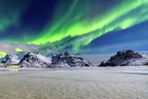 Green Colour Prints: Northern Lights (aurora borealis) illuminate the sky and the snowy peaks, Flakstad