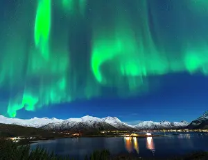 Northern Prints: Northern Lights display over Sildpollnes village reflected in Austnesfjorden in Lofoten Islands