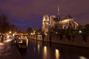 Floodlit Prints: Notre Dame Cathedral at night with River Seine, Paris, France, Europe