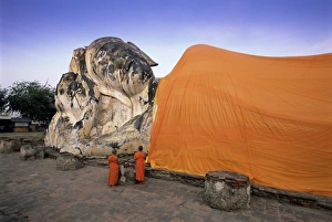 Clothes Prints: Two novice Buddhist monks in front of a statue of the reclining Budha
