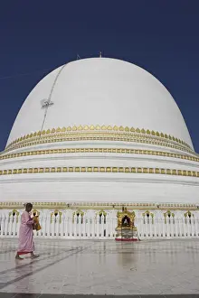 Bare Foot Prints: Nun in front of the 46m hemispherical dome at Kaunghmudaw Paya (Rajamanisula pagoda)
