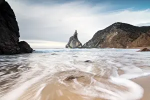 Sintra Prints: Ocean waves crashing on the sandy beach of Praia da Ursa surrounded by cliffs