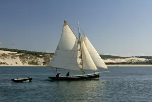 Images Dated 19th September 2008: Od gaff rigged sailing yacht and dinghy, sailing along Dune du Pyla, Bay of Arcachon