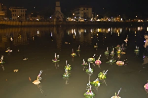 Religious Offering Prints: Offerings floating along river during Loi Krathong festival