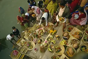 Offerings Prints: Offerings to the sun god Surya on the ghats during the Sun Worship Festival