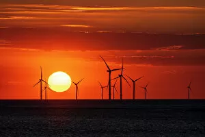 Silhouetted Gallery: Offshore wind farm with amazing sunset, New Brighton, Cheshire, England, United Kingdom, Europe