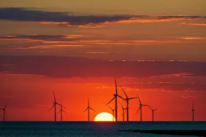 Silhouetted Gallery: Offshore windfarm with amazing setting sun, New Brighton, Cheshire, England, United Kingdom, Europe