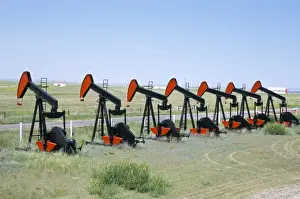 Equipment Prints: Oil pumps (nodding donkeys) for sale at oilfield supply merchants