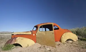 Absence Prints: Old abandoned car outside the service station at Solitaire
