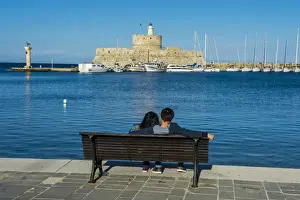 The old Agios Nikolaos fortress and lighthouse in Mandraki Harbour, Rhodes Town, Rhodes
