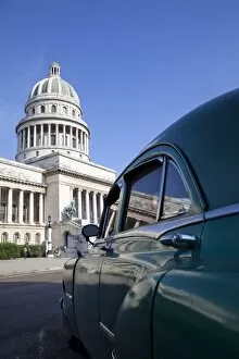 Old American car parked near the Capitolio building, Havana, Cuba, West Indies