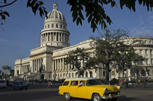 Capitolio Nacional Prints: Old American car passing the Capitolio Nacional, Havana, Cuba, West Indies