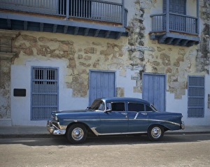 Old Havana Prints: An old blue Chevrolet car parked in a street in Old Havana, Cuba, West Indies