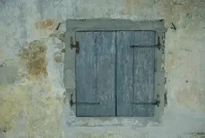 Detail of old blue shutters on a house in the Rhone Alpes in France, Europe