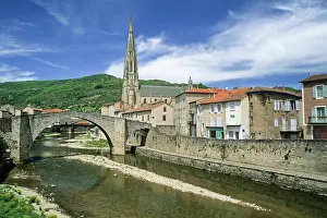 Aveyron Prints: Old bridge crosses the river near a church in Sainte-Affrique