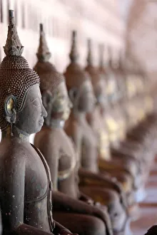 Foreground Focus Prints: Old Buddha statues in the cloister around the Sim, Wat Sisaket (Si Saket) Buddhist temple