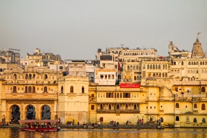 Gold Colour Prints: Old building facades, boat in foreground, City Palace side, Lake Pichola, Udaipur