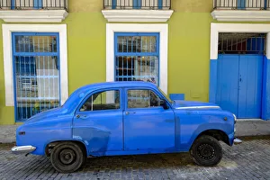 Vintage Car Prints: Old car parked in front of a colorful building, Old Havana, Cuba, West Indies
