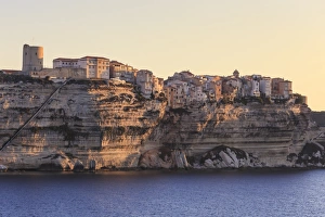 Clifftop Prints: Old citadel at dawn, in early morning light, seen from the sea, Bonifacio, Corsica