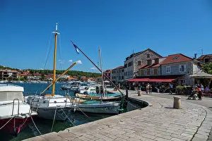 Small Prints: Old city scene with boats and waterfront at Stari Grad on Hvar Island in Croatia during a sunny day