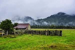 New Zealand Culture Prints: Old farm in a moody atmosphere, West Coast around Hst, South Island, New Zealand, Pacific