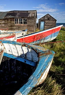 Old fis hing boats and delapidated fis hermens huts , Beadnell, Northumberland