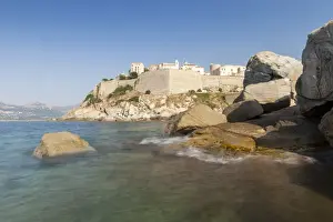 The old fortified citadel on the promontory surrounded by the clear sea, Calvi, Balagne Region