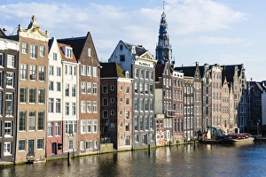 Traditionally Dutch Prints: Old gabled buildings near Damrak, Amsterdam, Netherlands, Europe