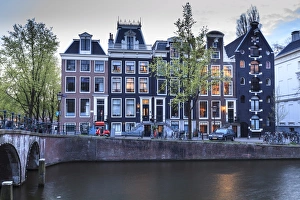 Gabled Prints: Old gabled houses line the Keizersgracht canal at dusk, Amsterdam, Netherlands, Europe