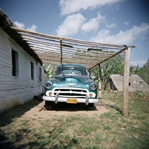 Caring Prints: Old green American car on farm near Vinales, Cuba, West Indies, Central America