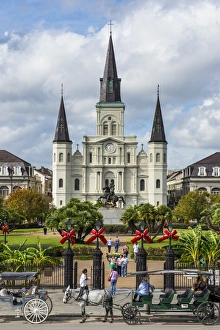 Old horse carts in front of Jackson Square and the St. Louis Cathedral, French quarter Old horse carts in front of Jackson Square and the St. Louis Cathedral, French quarter