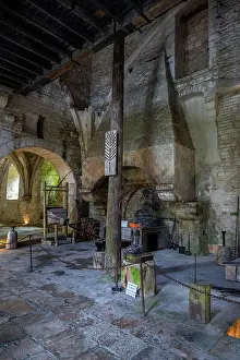 Large Prints: Old kitchen features stone walls and large fireplace in a historic site built in the medieval period in France
