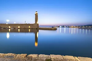 Rethymno Prints: Old lighthouse reflected in the calm sea during the blue hour