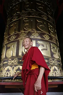 Monasteries Prints: Old man and prayer wheel, Kopan Monastery, Kathmandu, Nepal, Asia