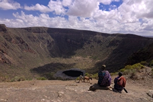 Images Dated 24th March 2008: Old man and son waiting to climb down in the soda crater to dig for salt