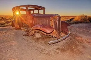 Automobiles Prints: An old Model-T placed as a marker for the Route 66 Road Alignment in Petrified Forest National Park