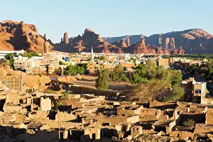 Arabia Prints: Old mudbrick village under reconstruction with new neighborhoods in the background